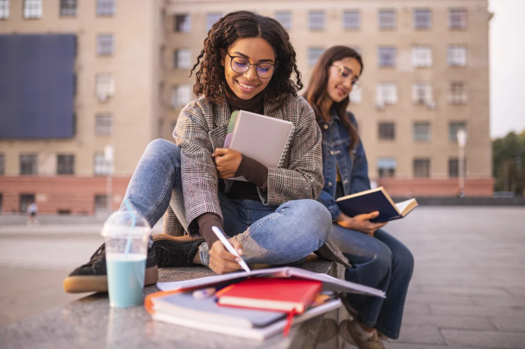 Two students reviewing notes for a medical prep course in Canada