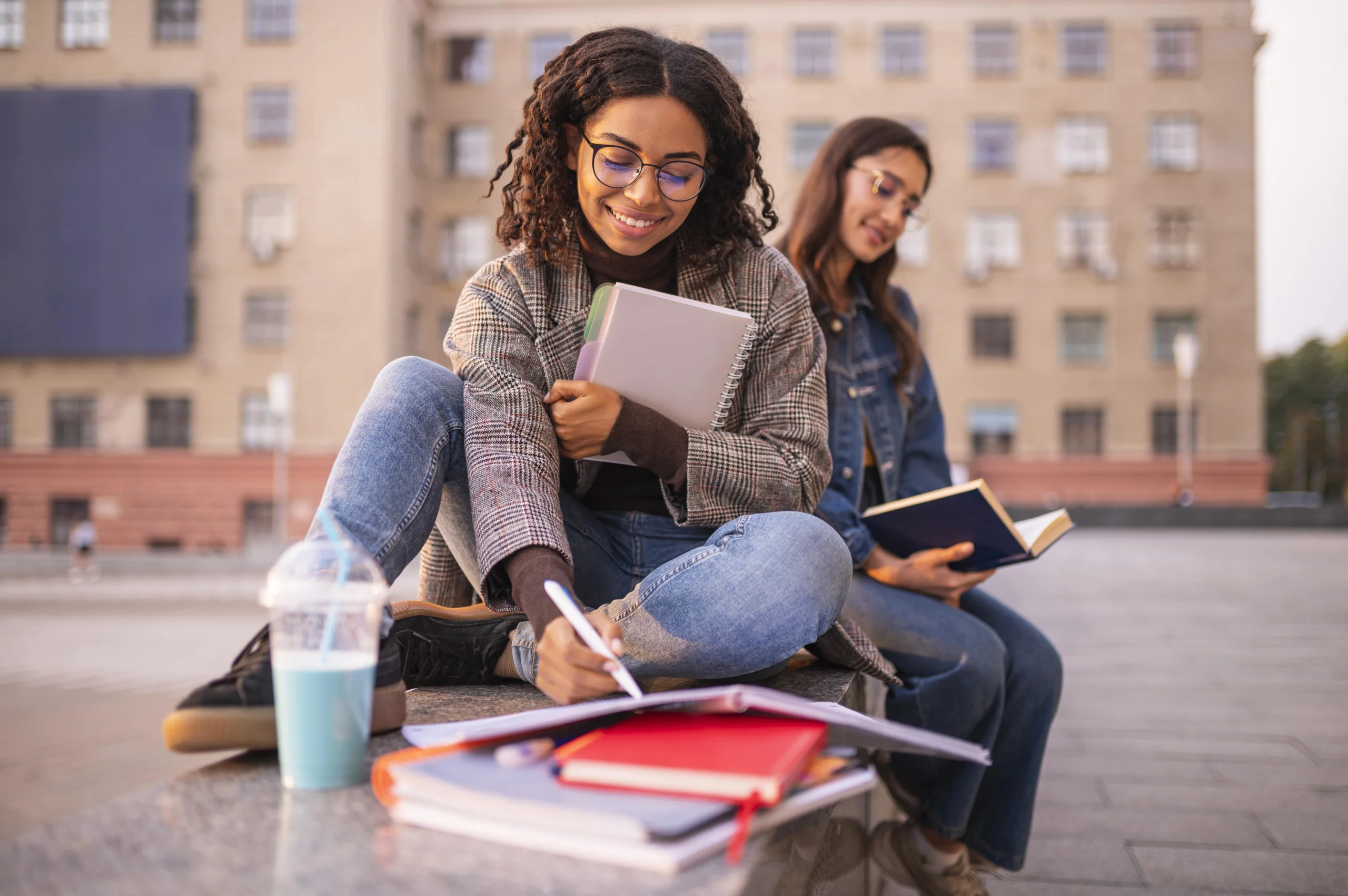 Two students reviewing notes for a medical prep course in Canada